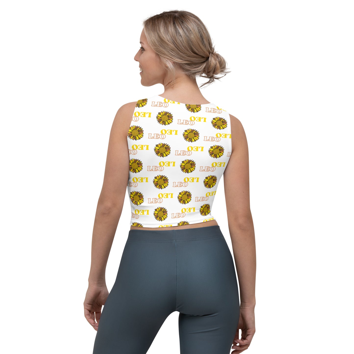 woman wearing white crop top with yellow Leo text and bright sunflower pattern