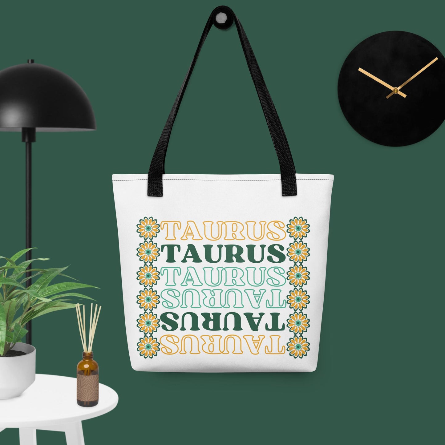 colorful retro Taurus tote bag with black bag straps, green and yellow flowers, and green and yellow text