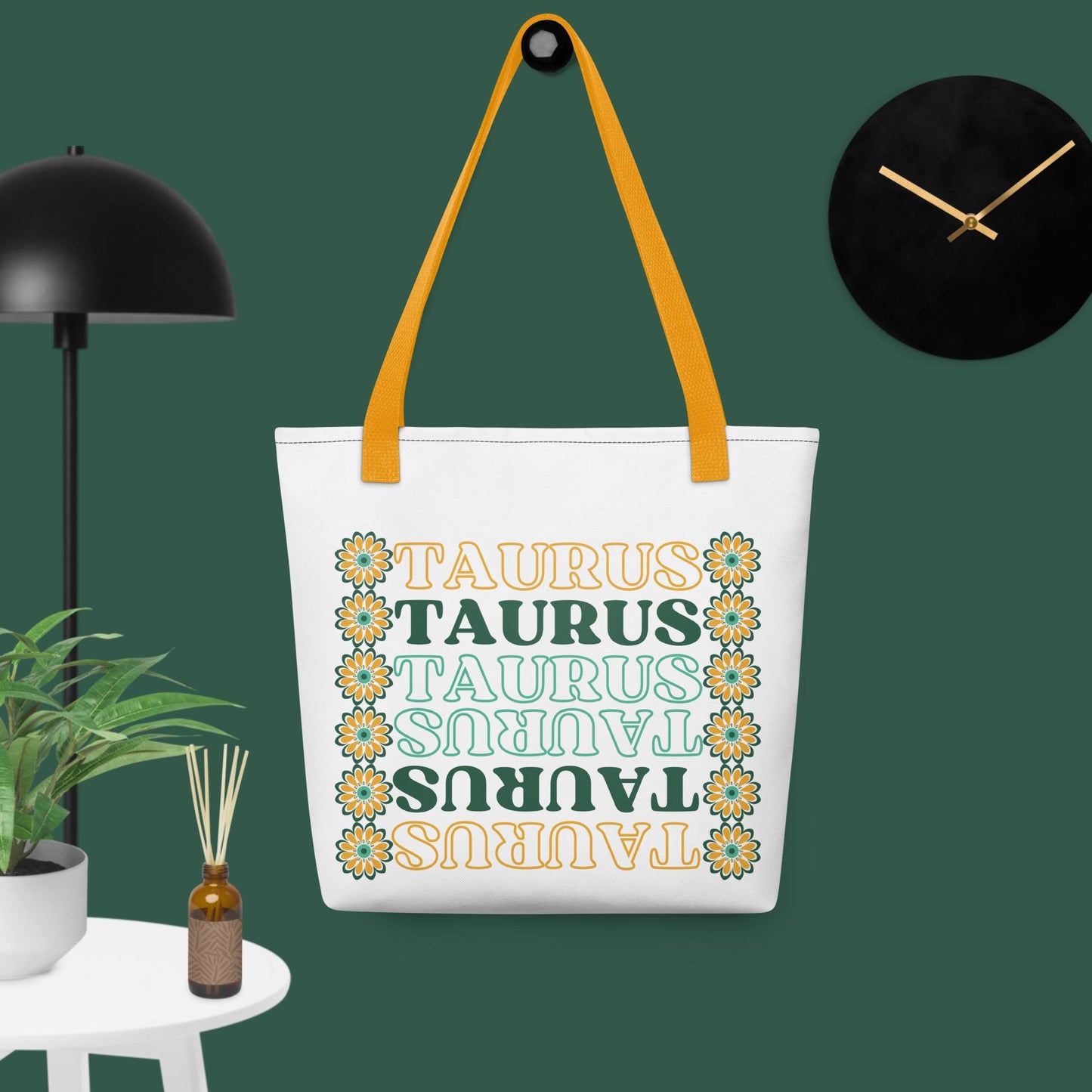 colorful retro Taurus tote bag with yellow bag straps, green and yellow flowers, and green and yellow text