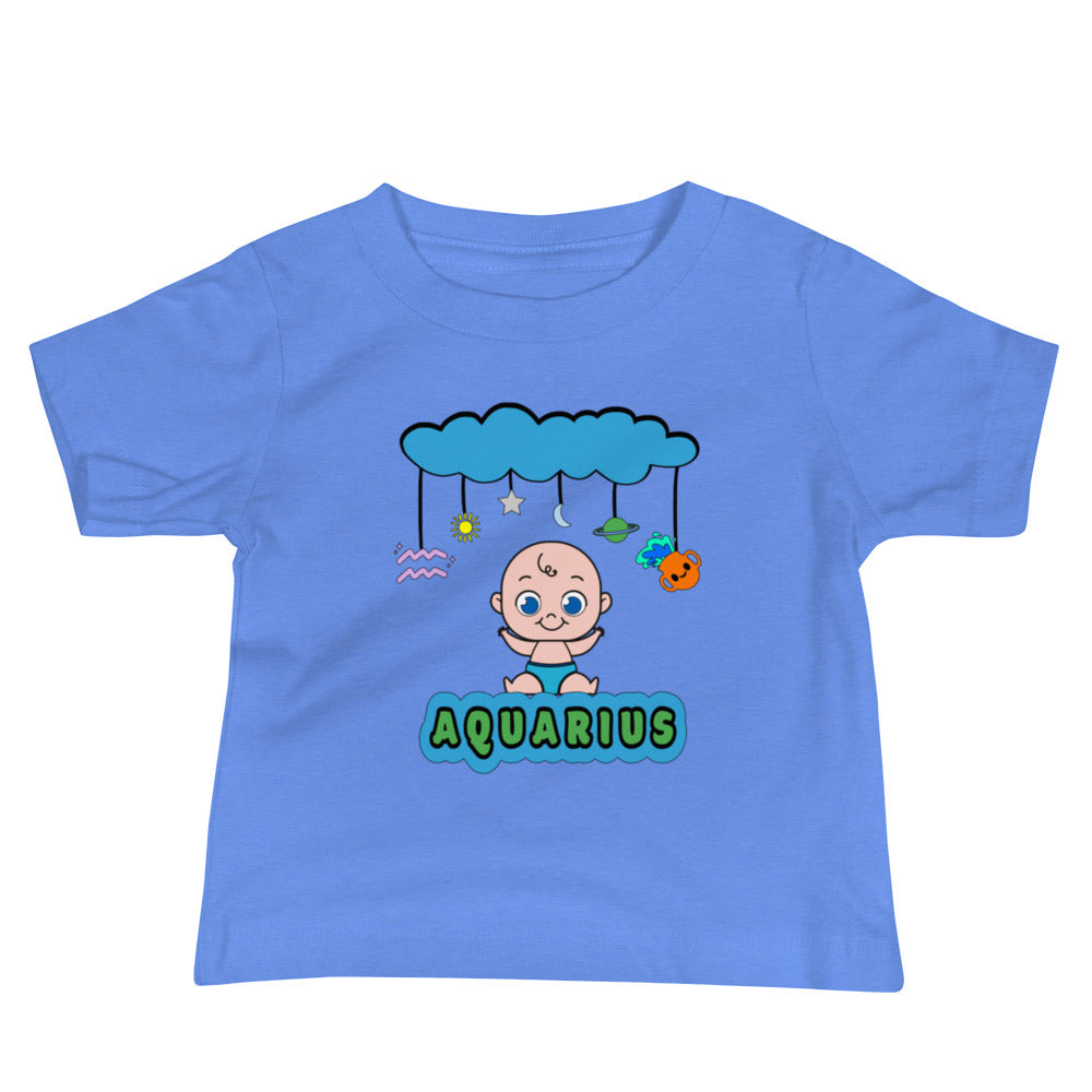 blue baby t-shirt featuring joyful light-skinned baby and a mobile with a cloud, star, moon, Aquarius symbol, Saturn, and a cartoon pot spilling water. The design combines playful celestial elements with a cozy fit