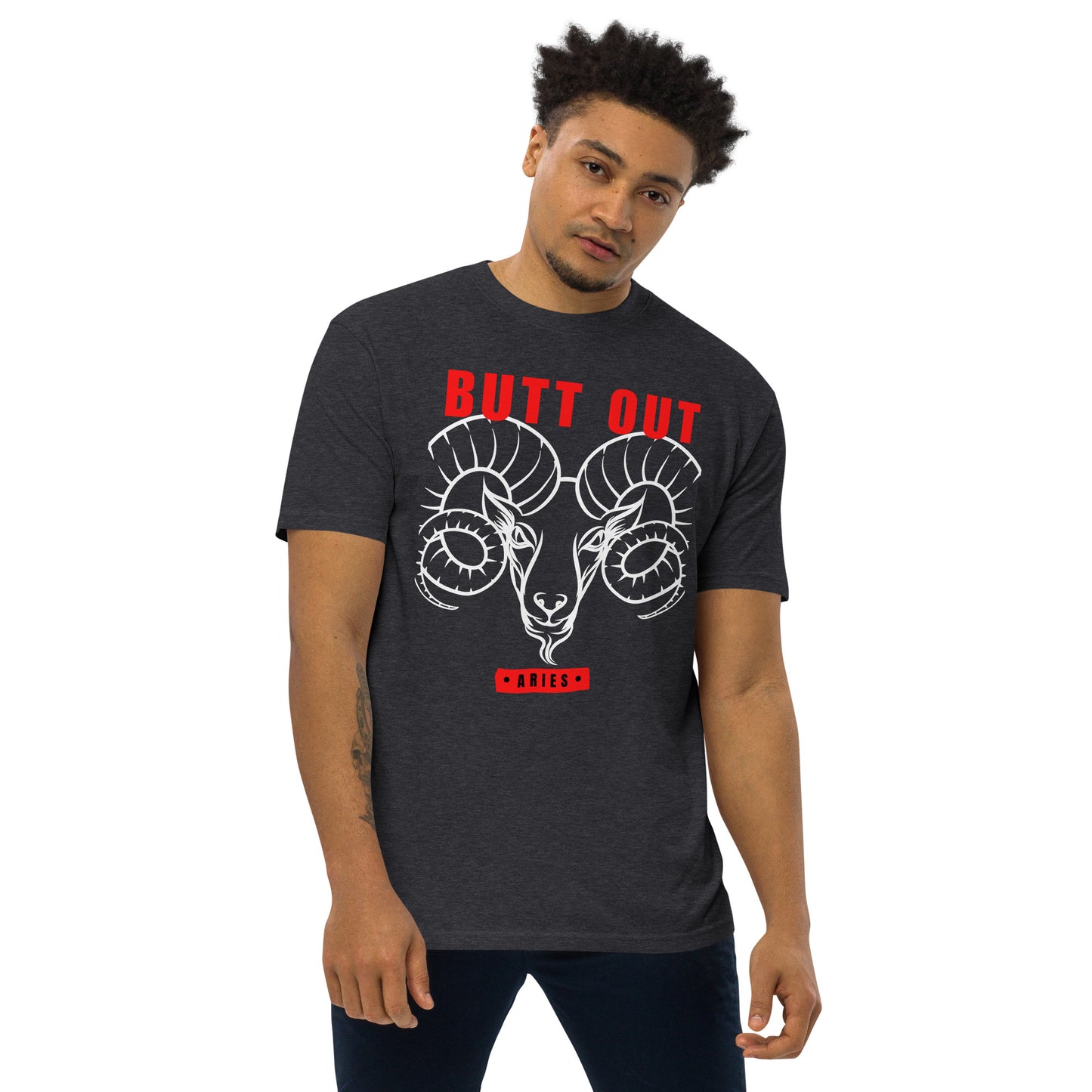 charcoal heather t-shirt featuring a bold ram design with the slogan 'BUTT OUT' in red above it and 'Aries' in red below. Modeled by a man, this shirt showcases a fierce and striking Aries theme