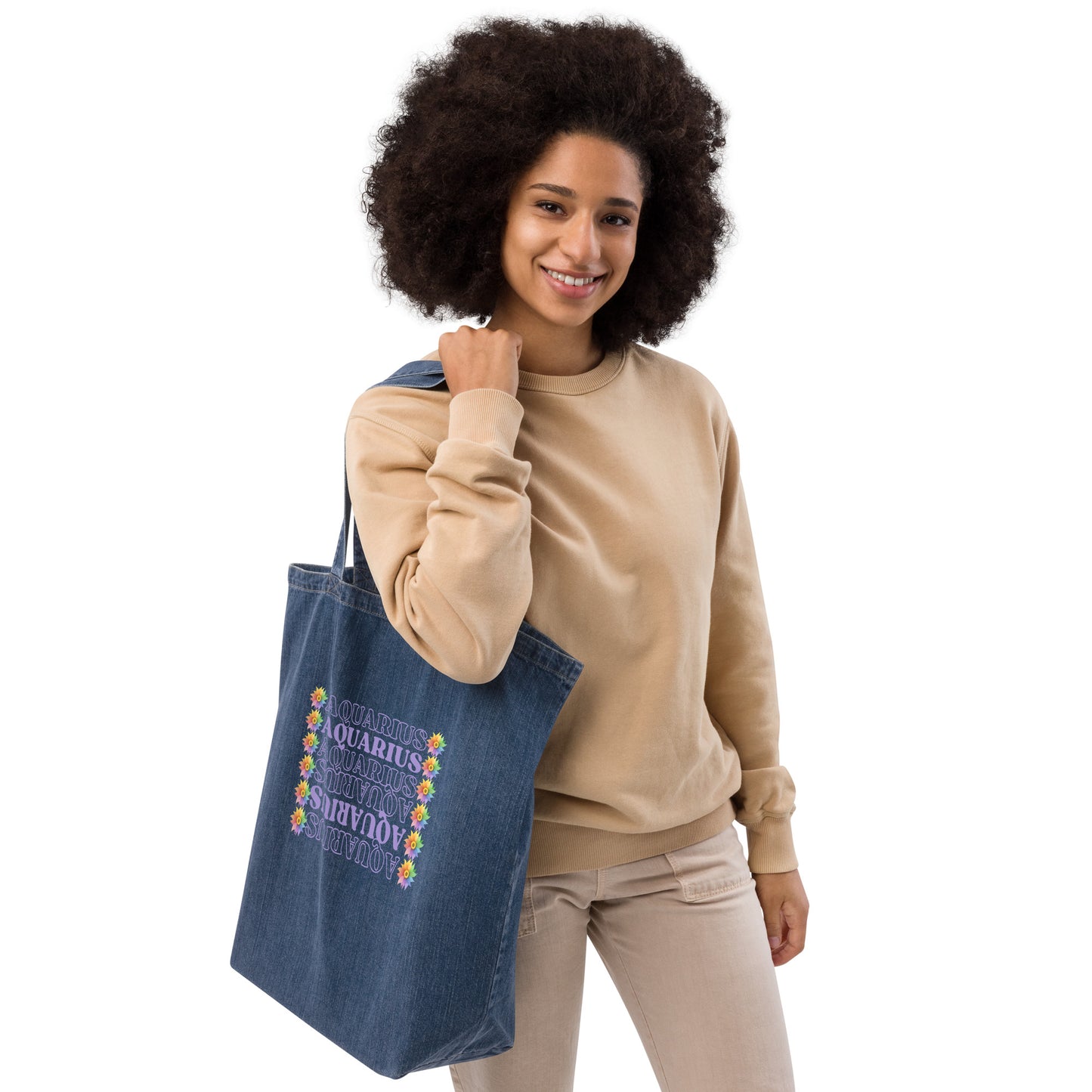 Denim tote bag featuring colorful flowers with the word ‘Aquarius’ repeated in a vertical row in purple text. The design combines floral elegance with a touch of celestial charm