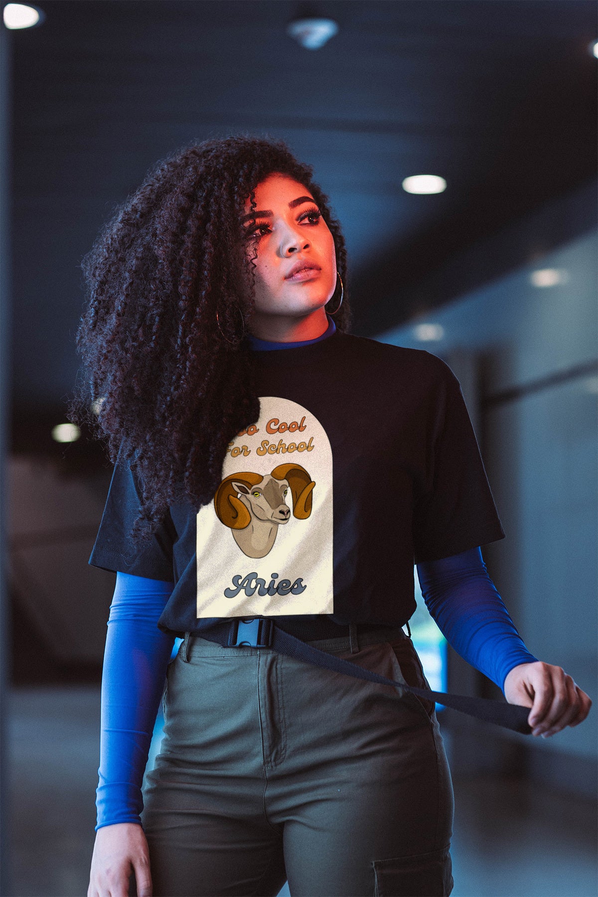 black aries zodiac sign retro t-shirt that says too cool for school aries with a picture of a cartoon ram