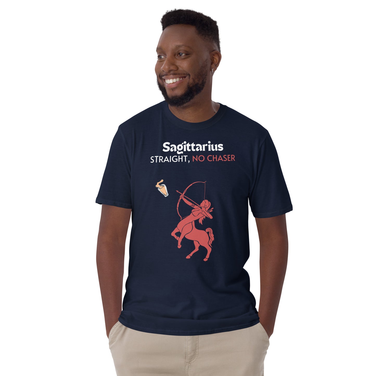 model wearing navy t-shirt lying flat on a light background, featuring a bold "Sagittarius - Straight, No Chaser" design. The graphic showcases a red centaur archer aiming at a drink, embodying the fearless and straightforward nature of Sagittarius.