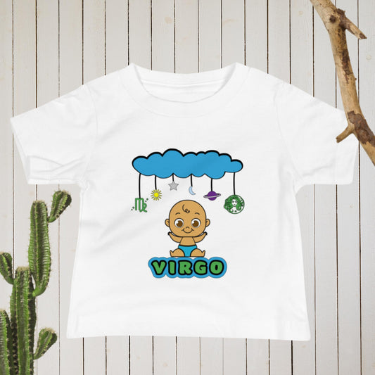 white infant t-shirt featuring a brown baby smiling underneath a cloud mobile design with virgo symbols and planets