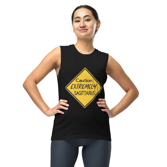 A person wearing a muscle tank top with a yellow warning sign that reads "Caution: Extremely Sagittarius.