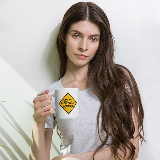 white zodiac Mug featuring bold yellow caution sign with “Extremely Aquarius” print